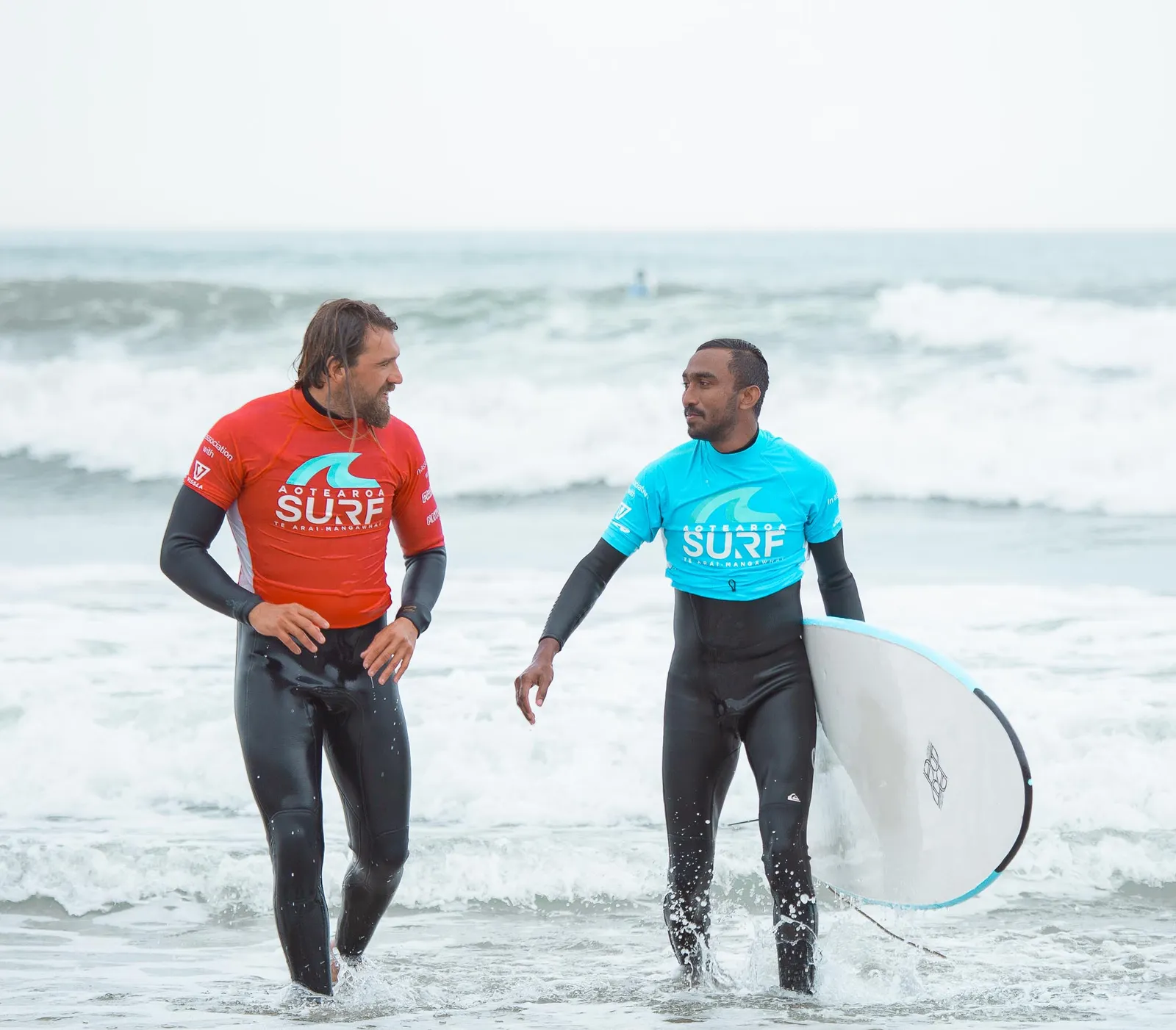 Adult surfer up and riding in the morning session