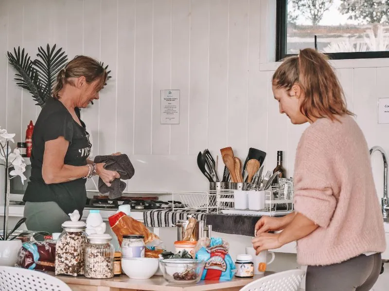 Guests sorting gear in the shared kitchen