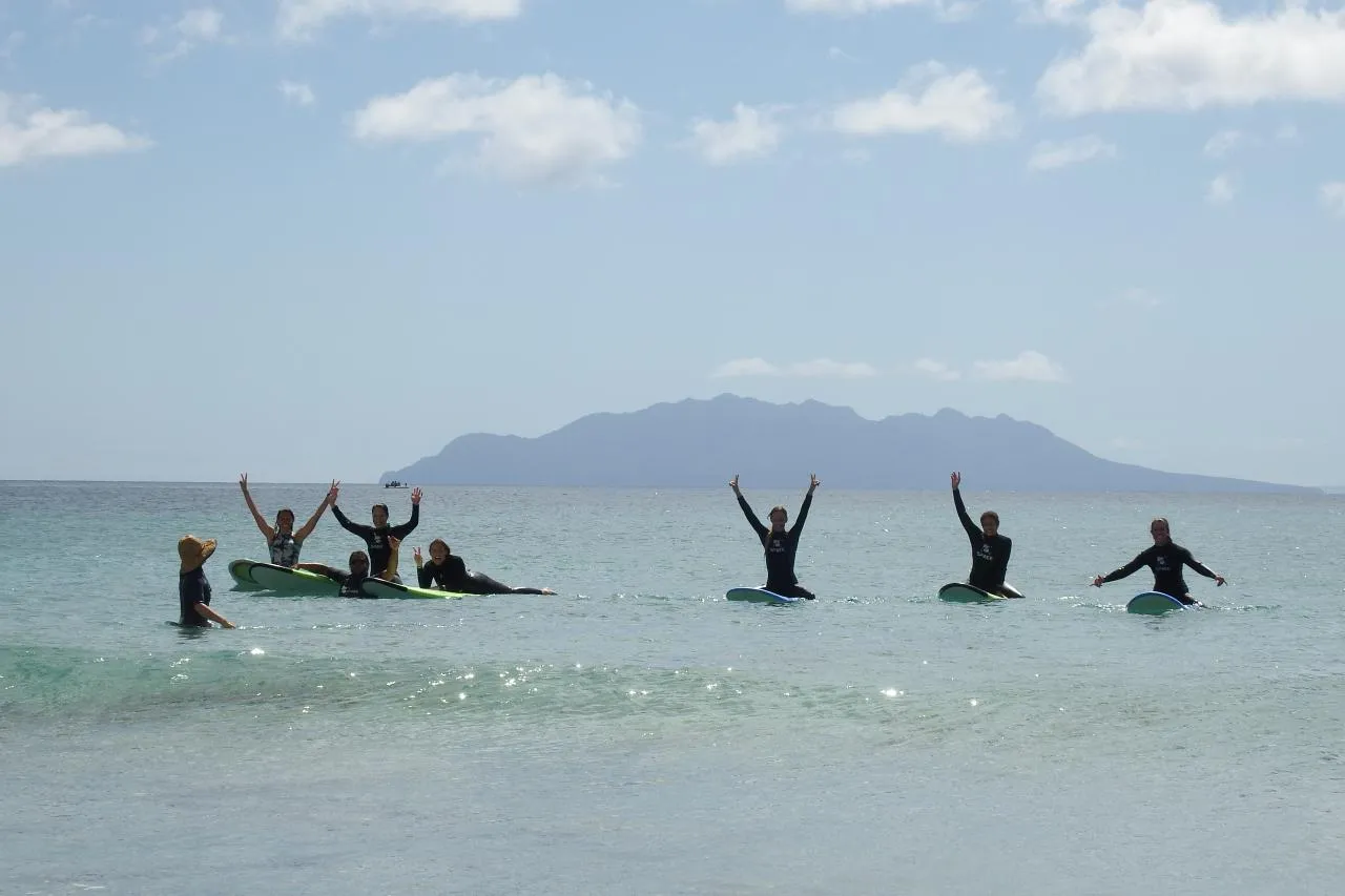 Group lesson celebrating waves in the shallows