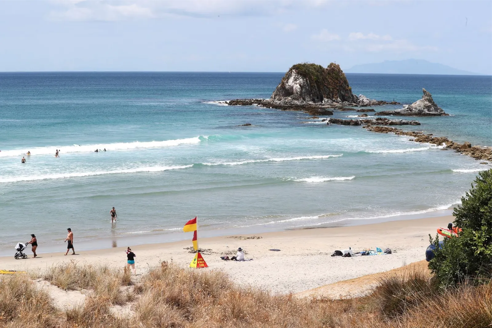 Mangawhai beach with its landmark rock