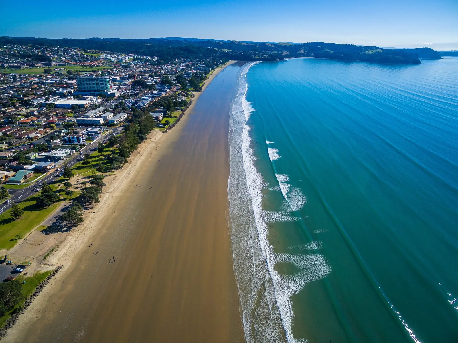 Orewa beach from above with long peeling waves