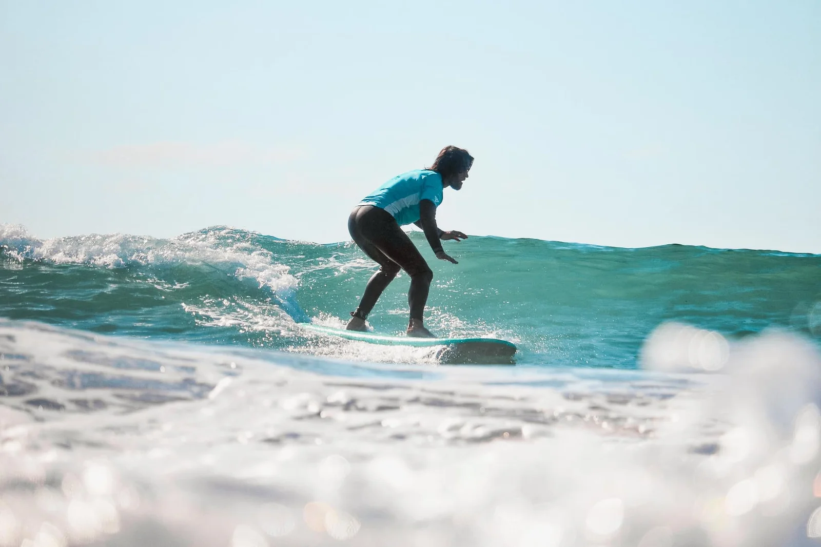 Surfer riding a clean wave on a private session in Christchurch