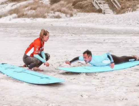 Private coaching on the sand at Te Arai before paddling out