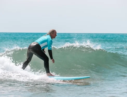 Sista trimming a clean small wave at Te Arai