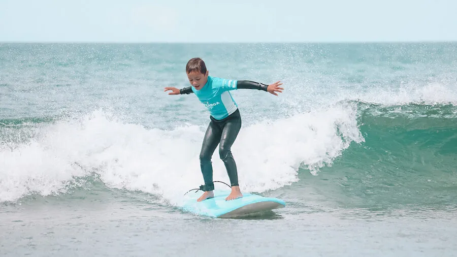Camper riding a wave all the way to the beach