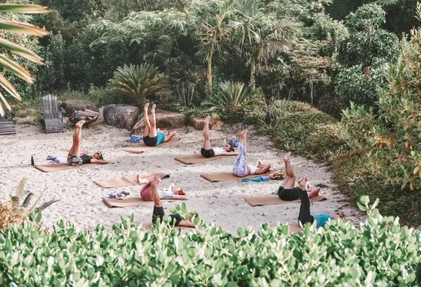 Yoga mats rolled out among the greenery