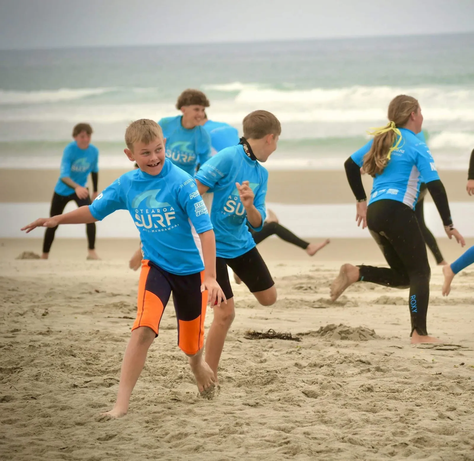 Campers sprinting down the beach